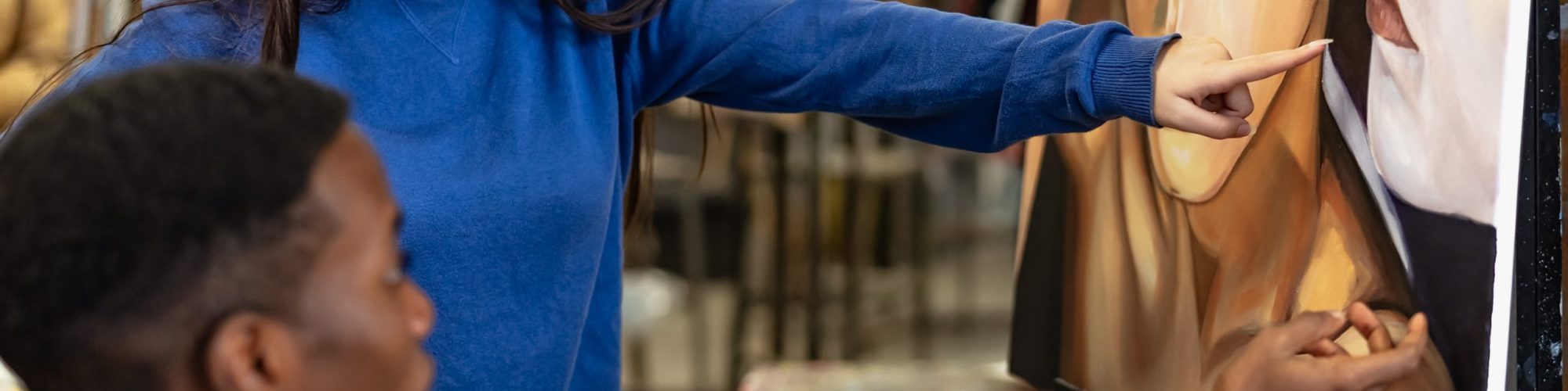 Young multiracial students learning about painting on canvas during lesson in faculty of arts university - Education and culture concept